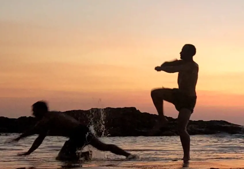 Muay Thai Fighters training Muay Boran on the beach in Khao Lak, Thailand